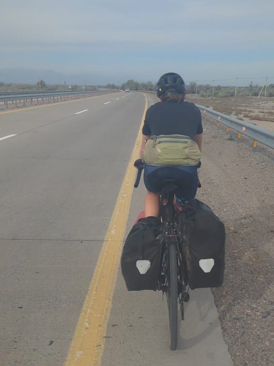 Cyclist on a Kazakh motorway
